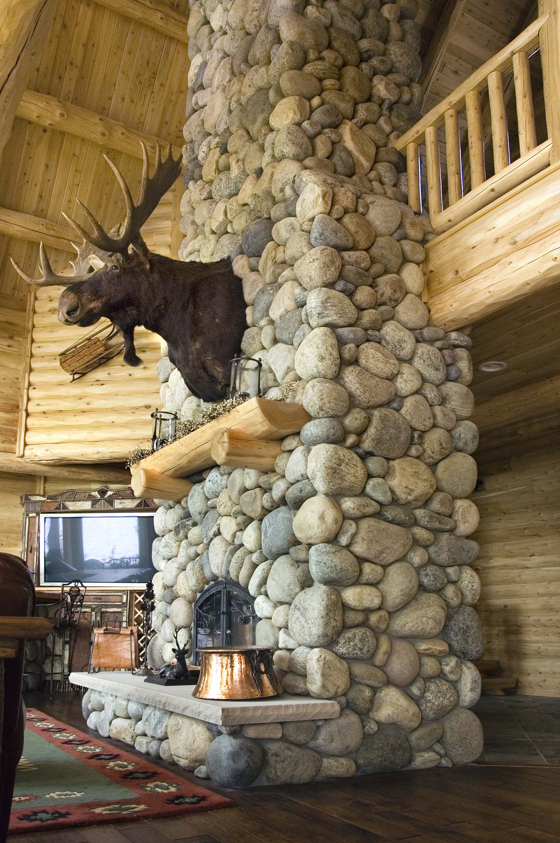 Adirondack Fieldstone fireplace in log cabin