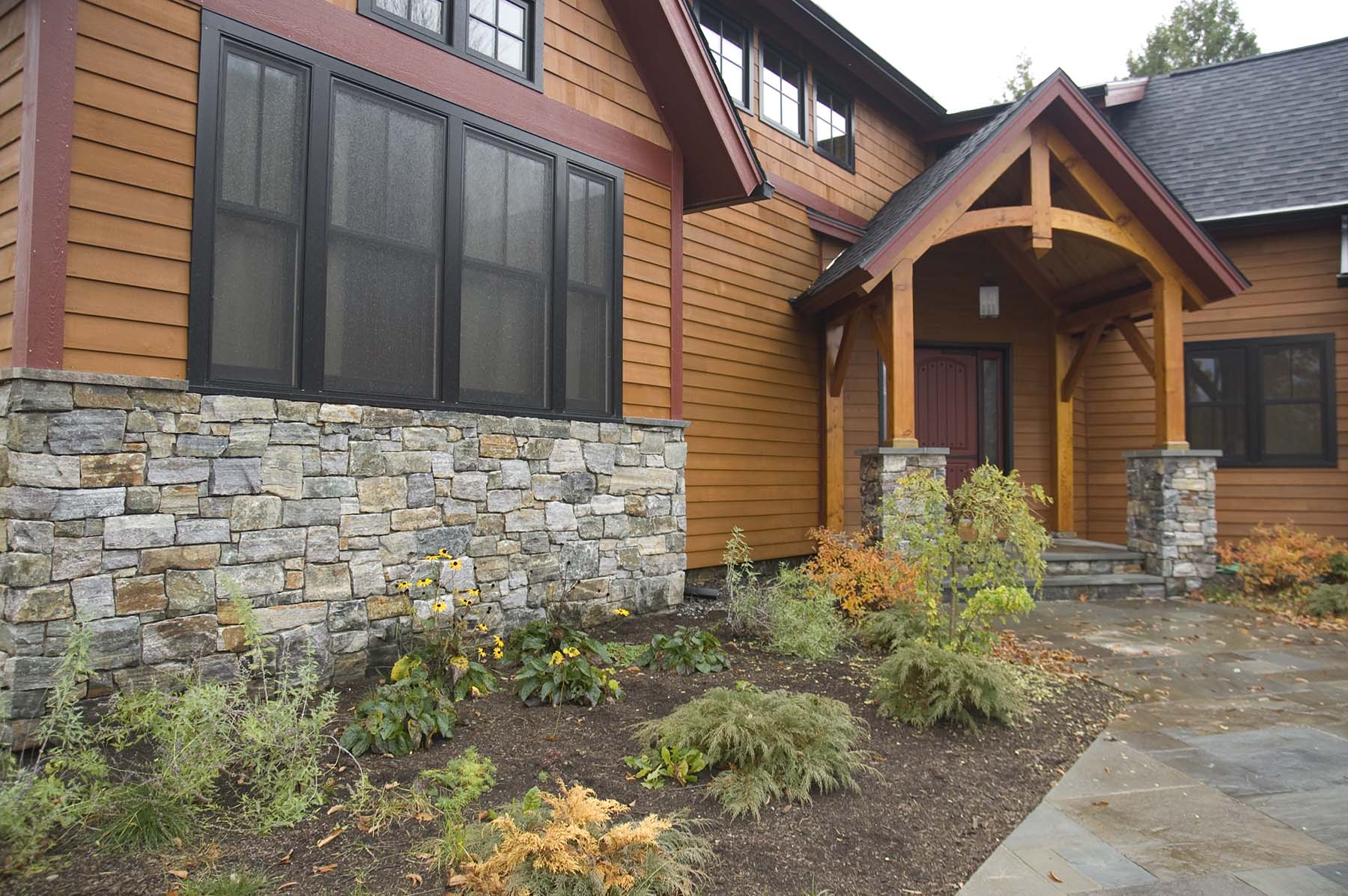 residential home with american granite natural stone exterior wall and porch