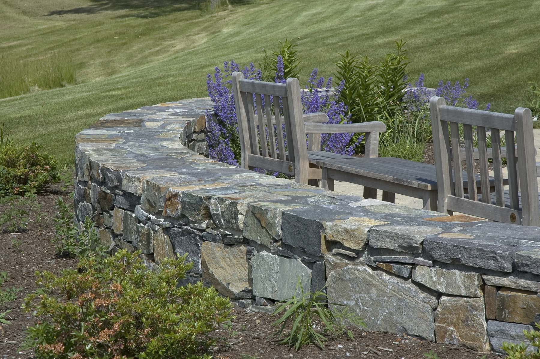 natural stone retaining wall outside in garden