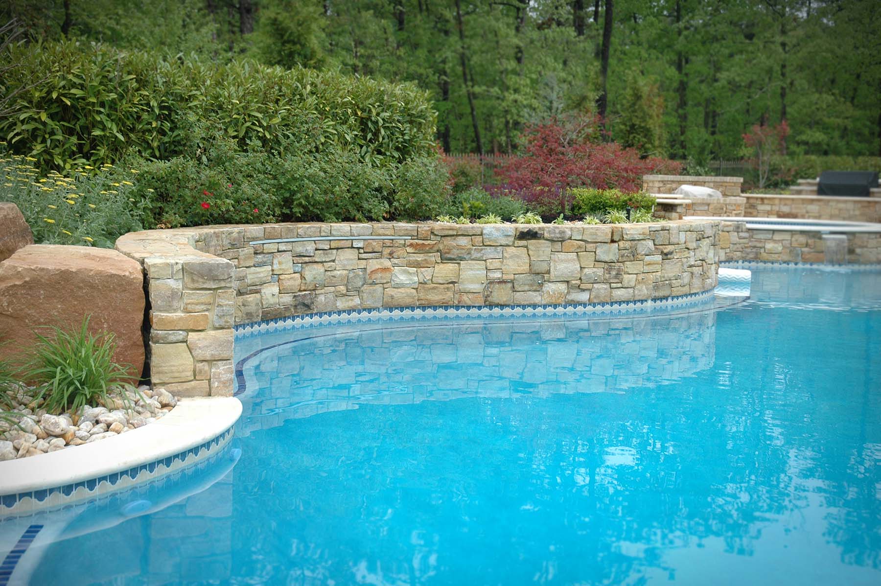 Pool with South Bay Quartzite natural building stone exterior retaining wall