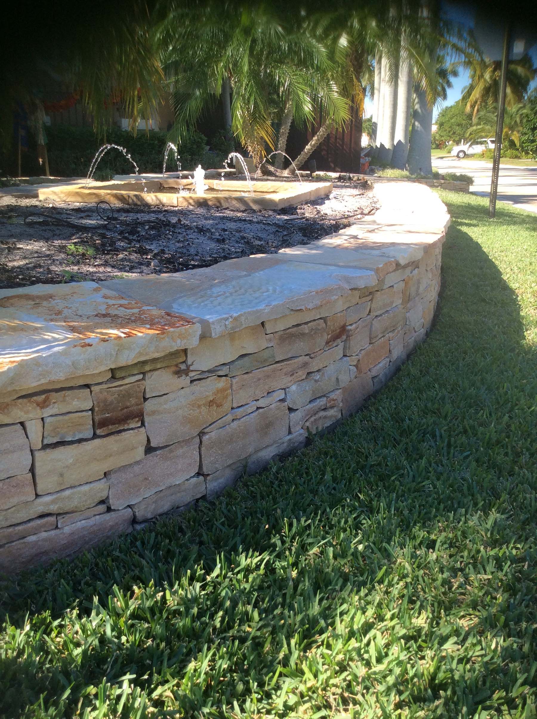 Park with South Bay Quartzite natural building stone wall surrounding fountain