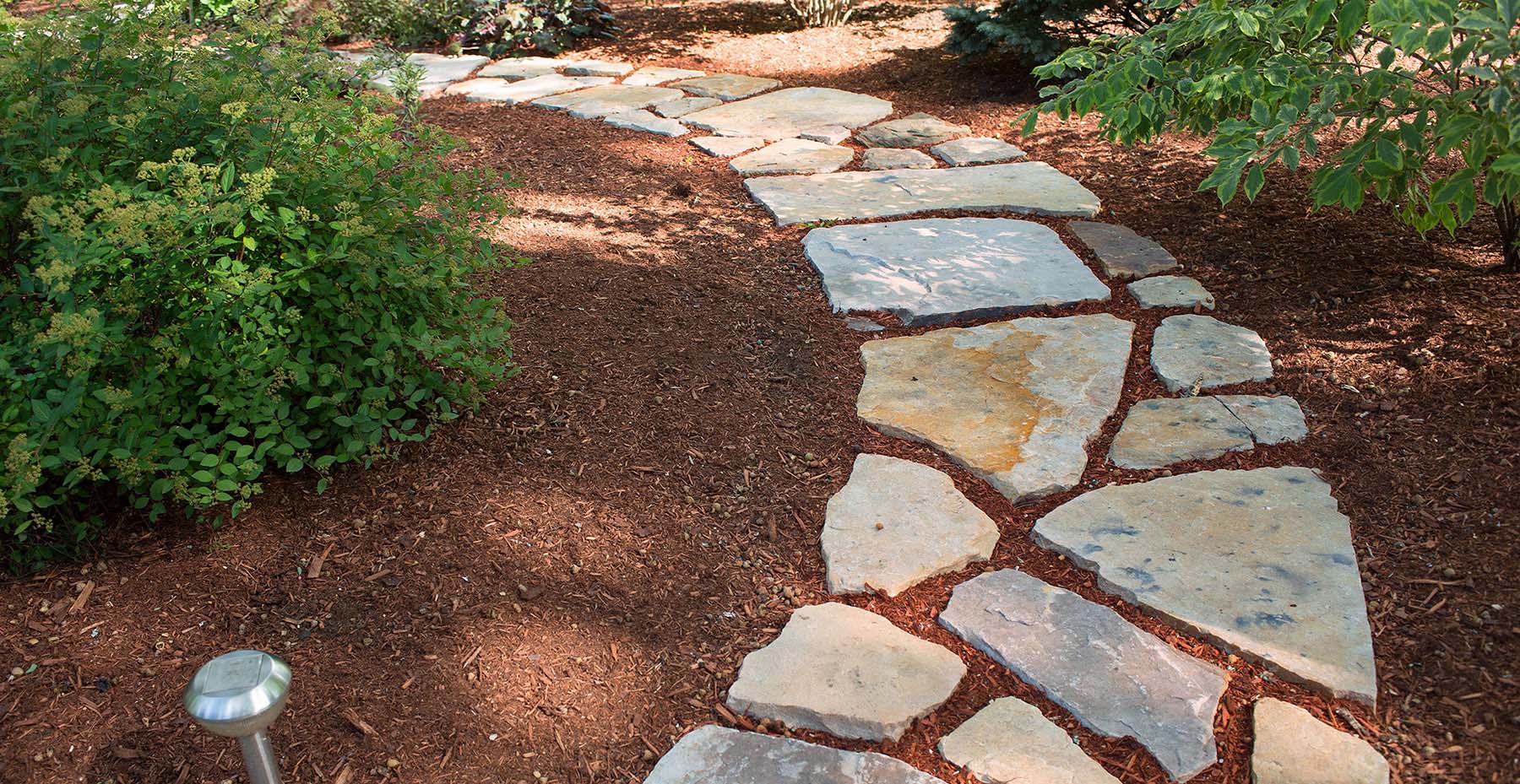 South Bay Quartzite natural stone flagging walkway in garden