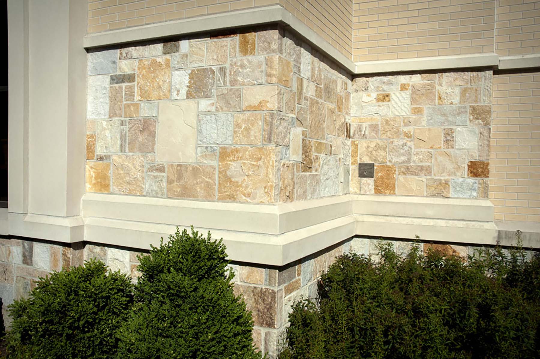 Close up of building wall with South Bay Quartzite natural building stone exterior