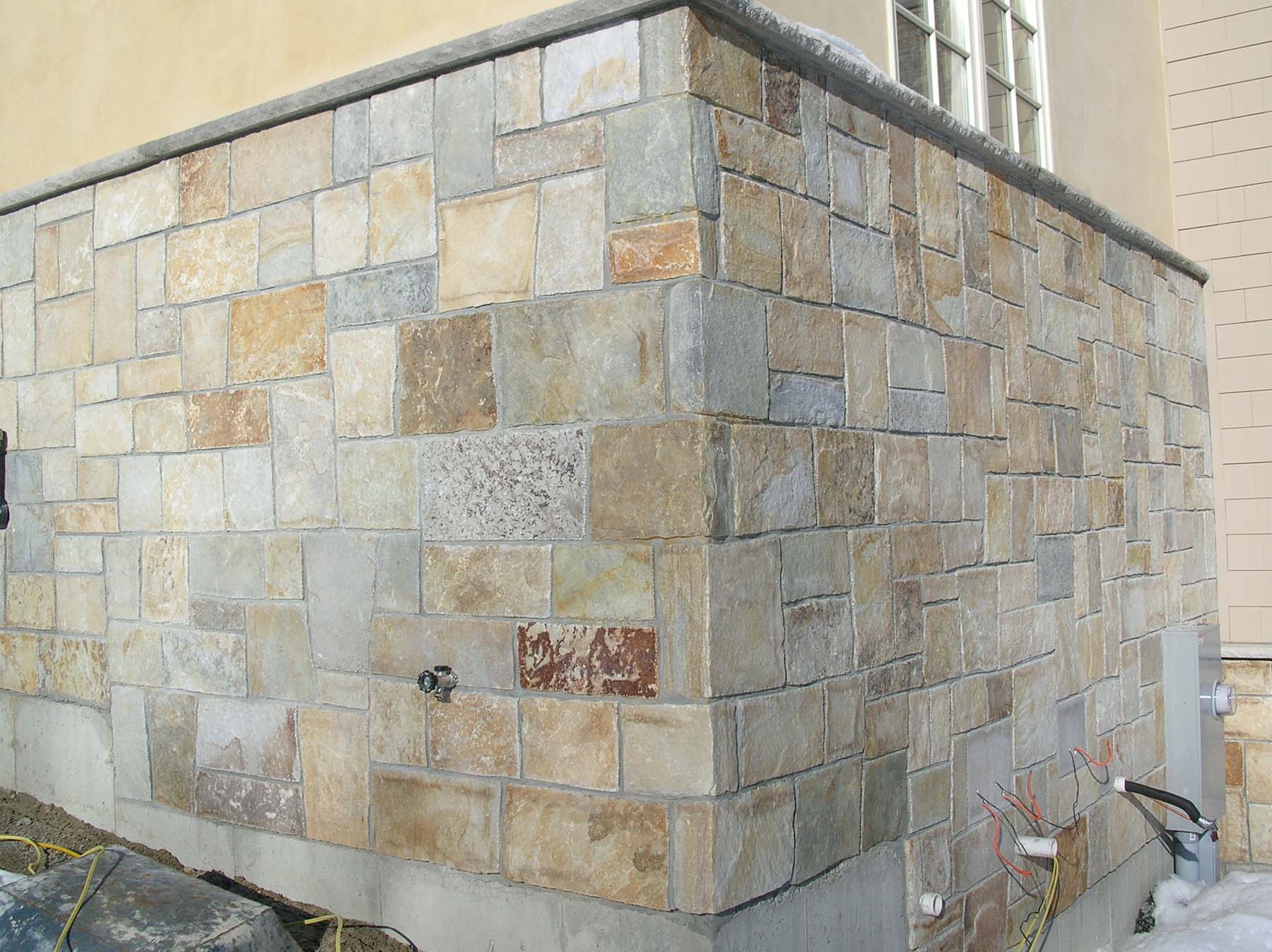 Close up of building wall with South Bay Quartzite natural building stone exterior