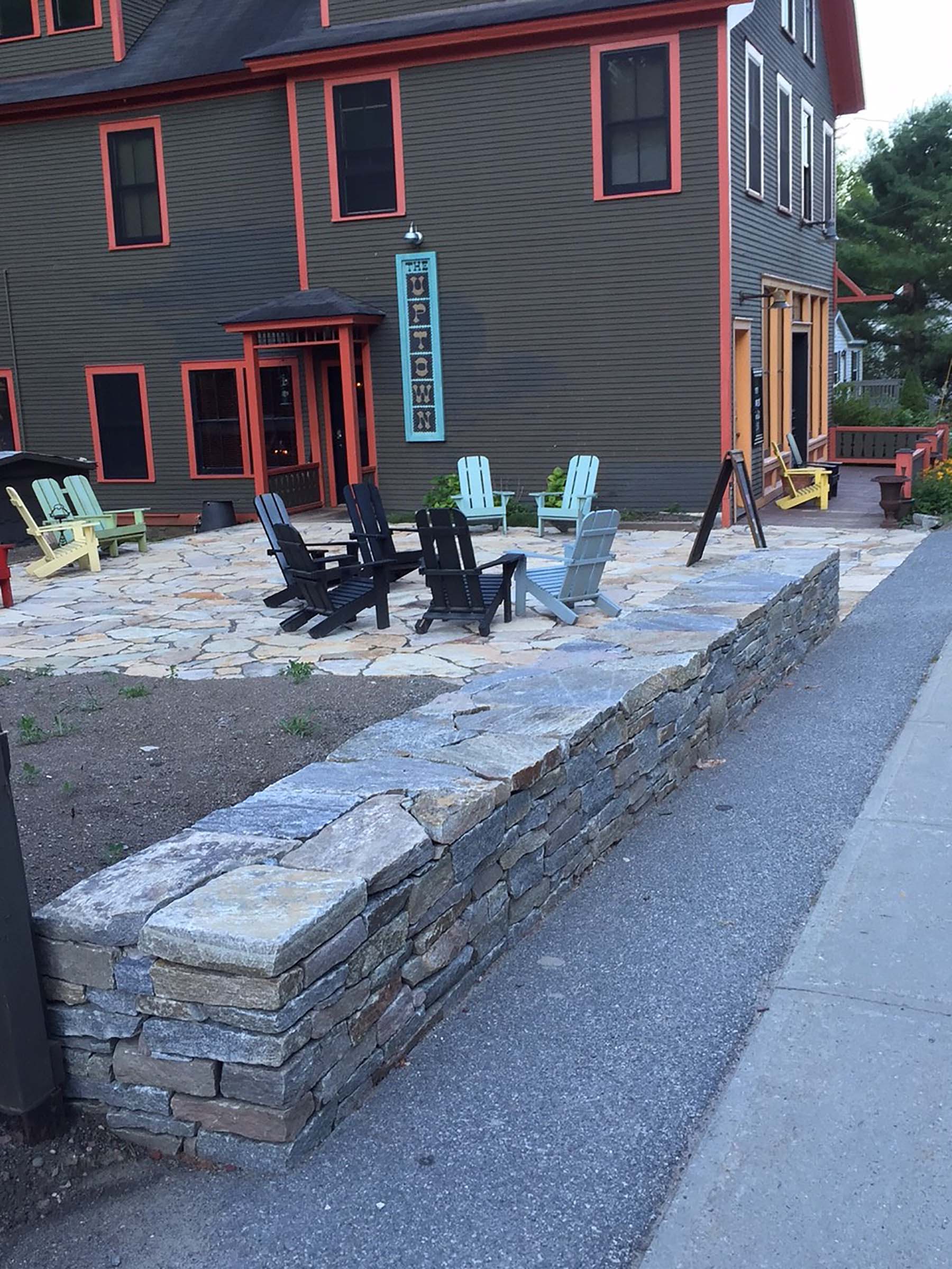 natural stone Ticonderoga granite wall and patio outside business