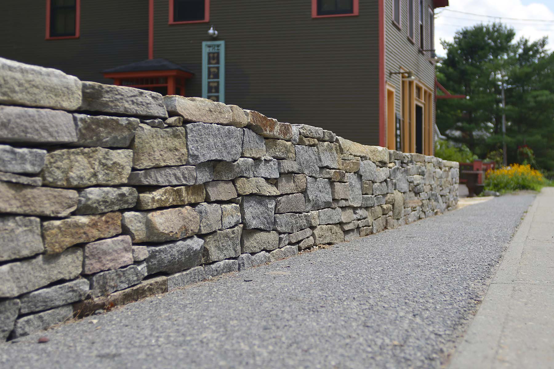 natural stone Ticonderoga granite wall outside business