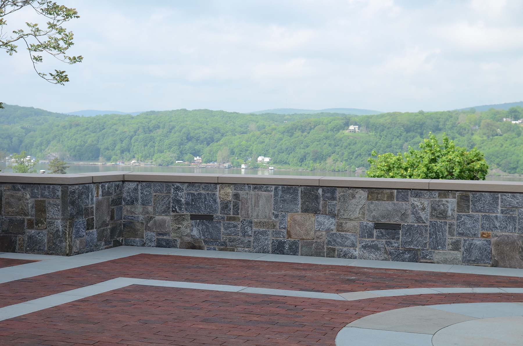 Ticonderoga granite natural stone wall in park overlooking lake