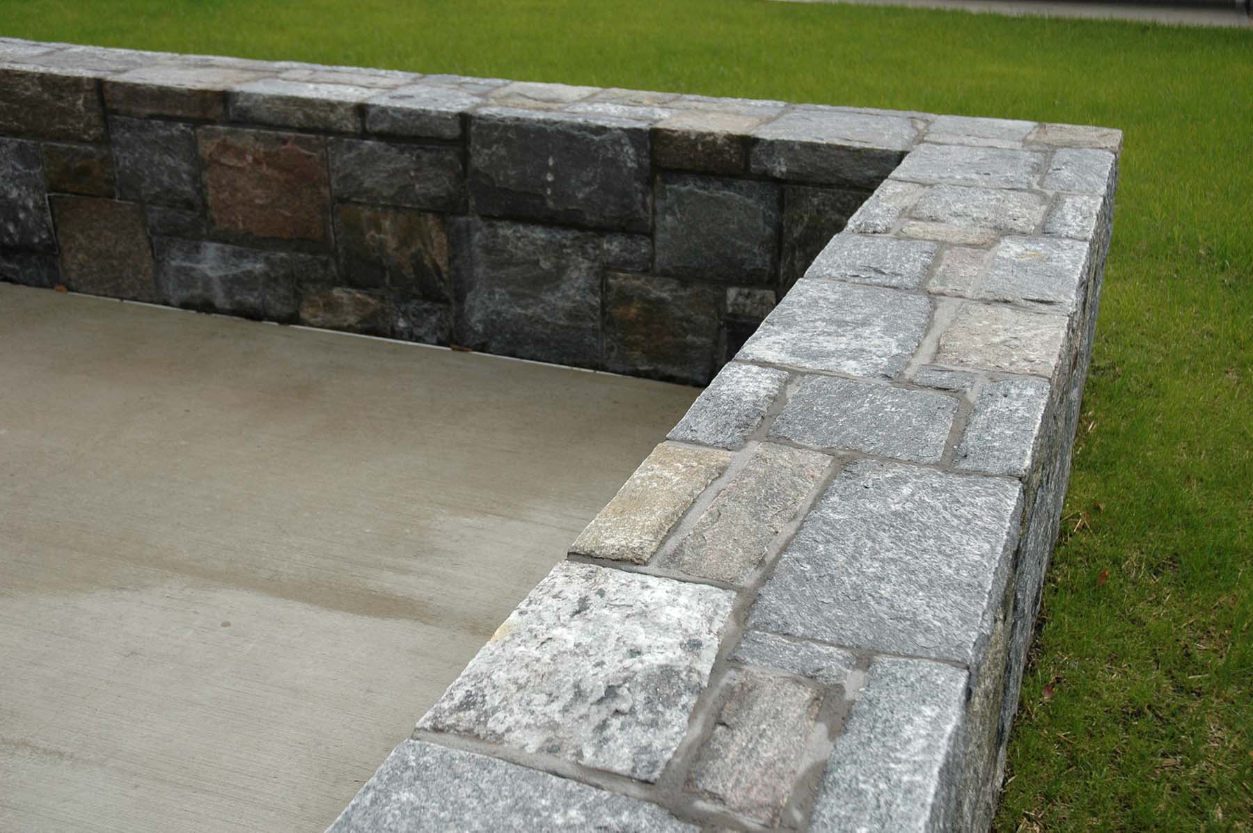 Ticonderoga granite natural stone wall in park